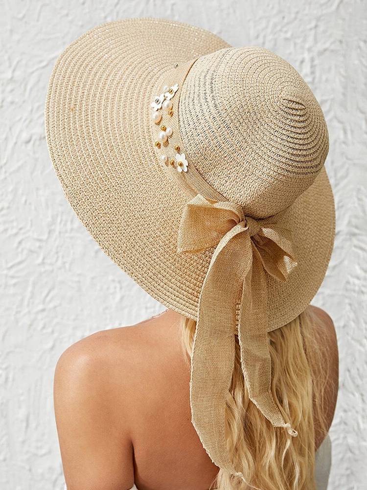 Mujer Paja Color sólido Elegante ala grande Perla Bowknot Visera de borde ondulado Sol Sombrero Playa Sombrero Cubo Somb