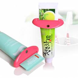 Crema del tubo del dosificador de la pasta de dientes del cuarto de baño exprimidor del producto de limpieza facial