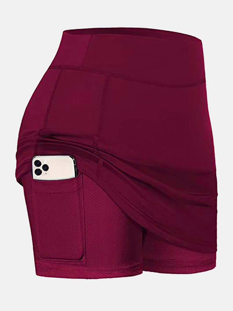 Pantalones cortos deportivos de color liso para mujer Falda de tenis transpirable con forro de compresión con bolsillo
